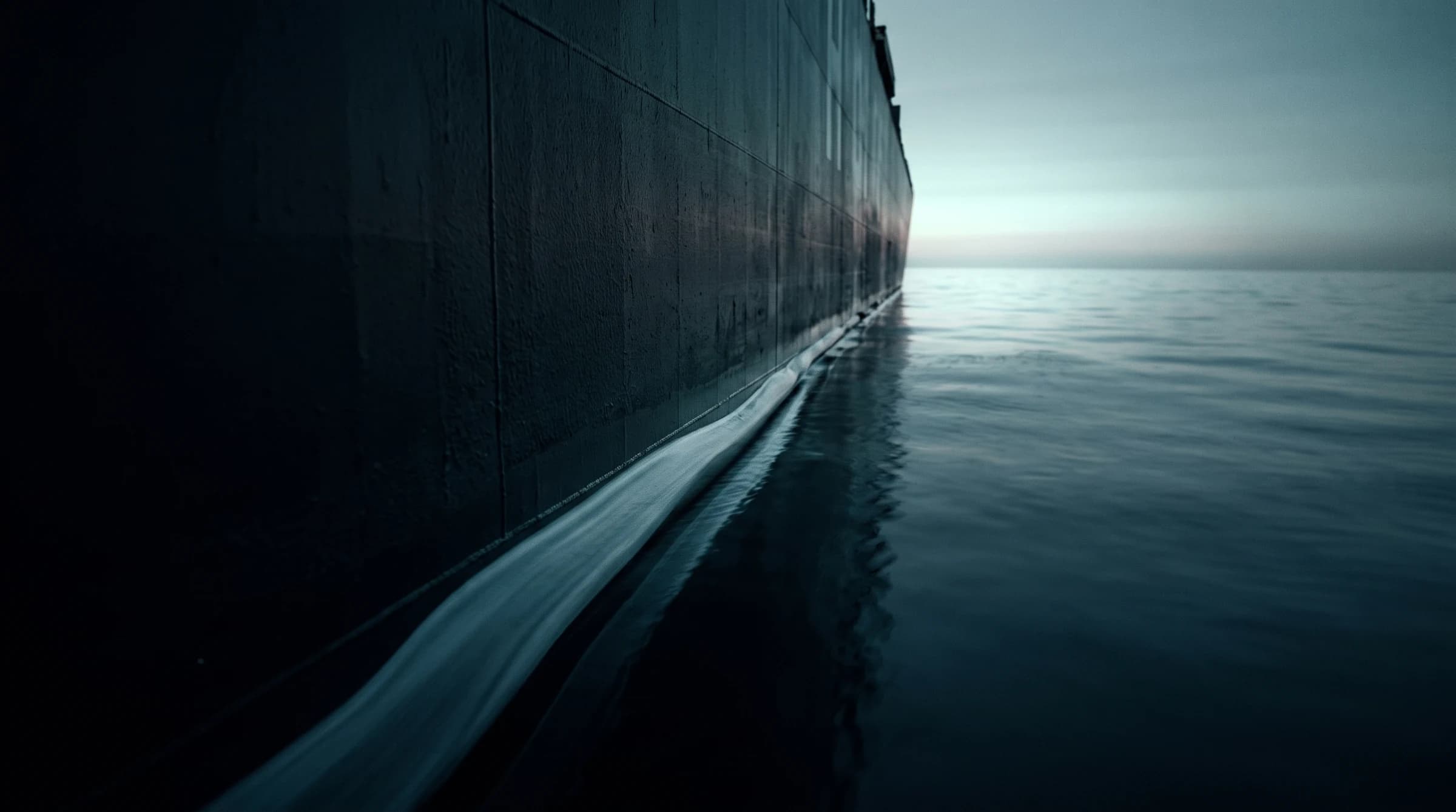 The hull of a large ship at the waterline