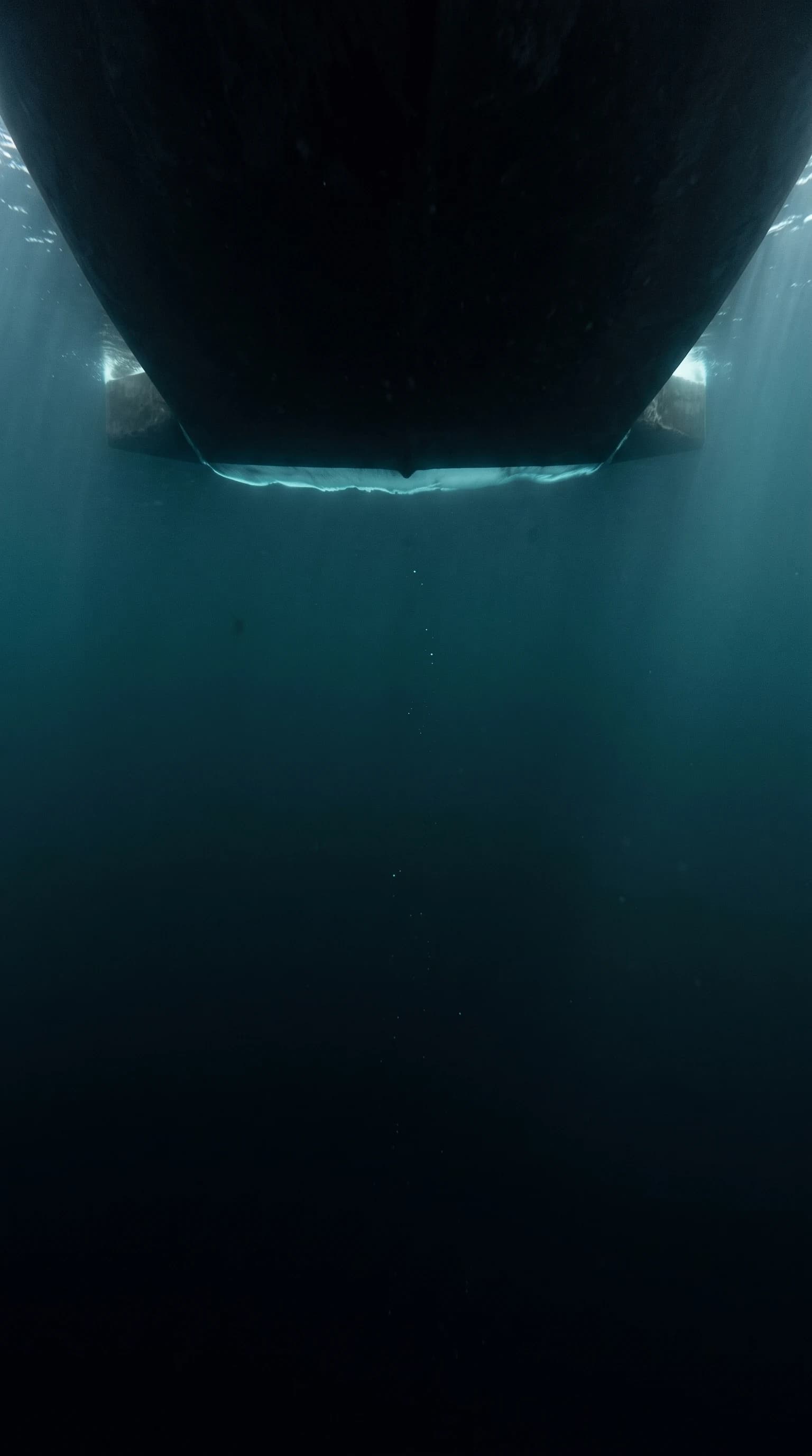 The underside of a ship's hull, with a bright layer of air along its bottom